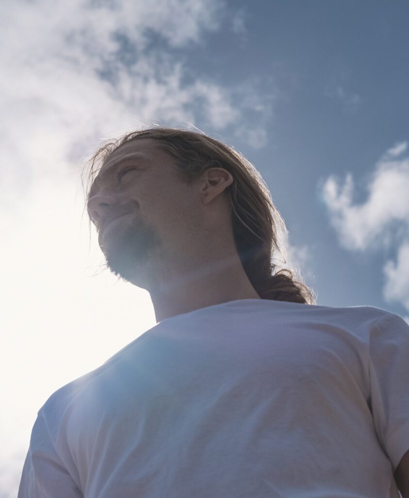 portait of a man outside under the blue sky