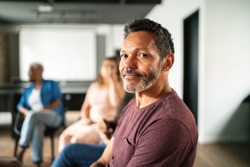 man in group therapy