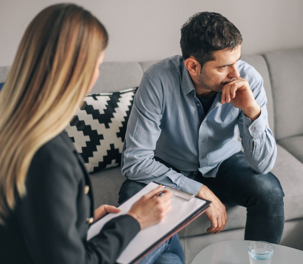 man in a counseling session with his therapist