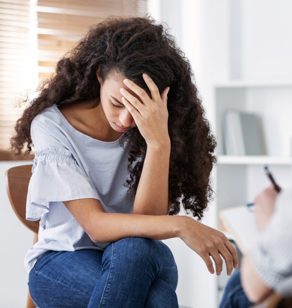sad woman talking to her therapist