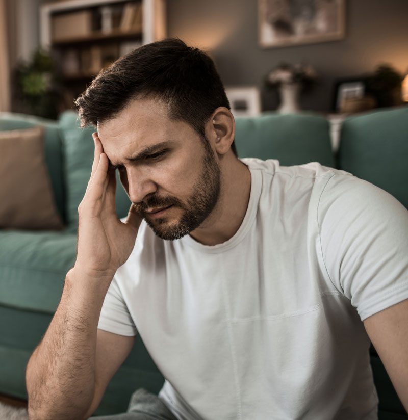 worried man with a headache