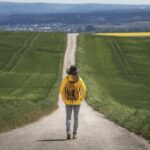 A person standing on a road.