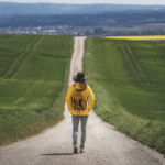 A person standing on a road.