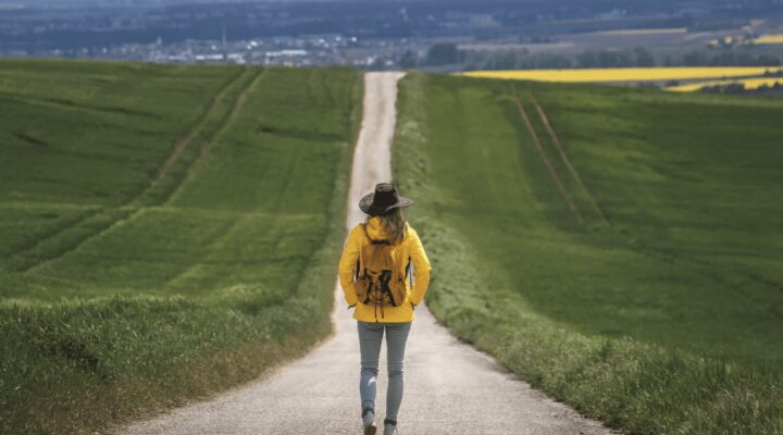 A person standing on a road.