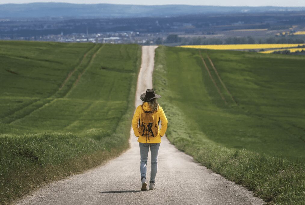 A person standing on a road.