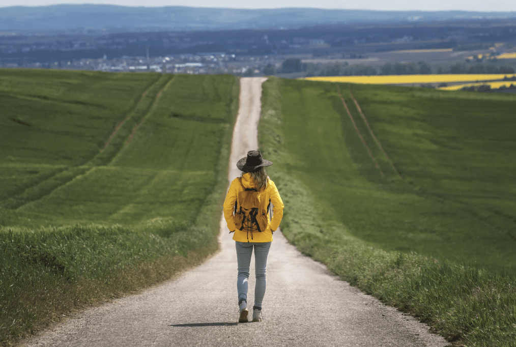 A person standing on a road.